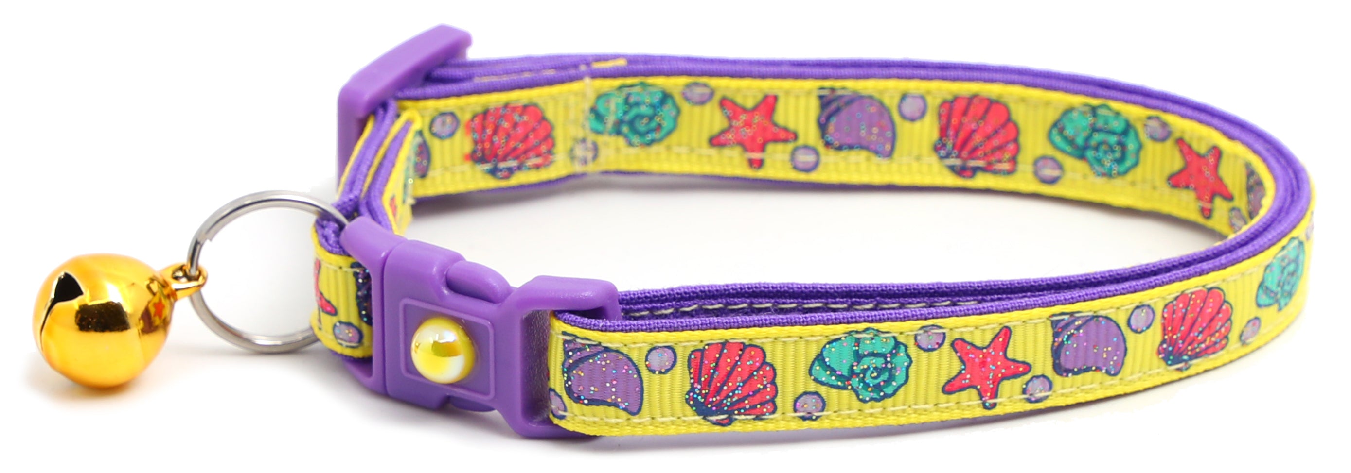 Beachcomber Breakaway Cat Collar in vibrant colors, featuring a breakaway clip and removable bell, made from soft reinforced cotton.